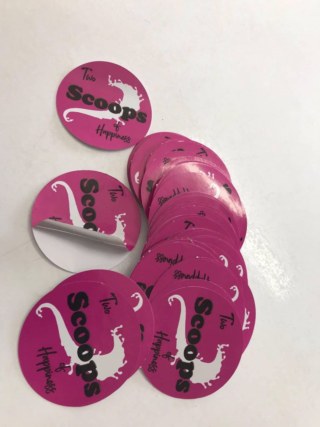 Stack of pink round printed stickers